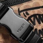 Coach Rivington Belt Bag In Signature Canvas With Rexy