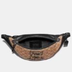 Coach Rivington Belt Bag In Signature Canvas With Rexy