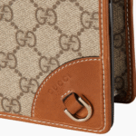 Gucci Emblem wallet with leather strap